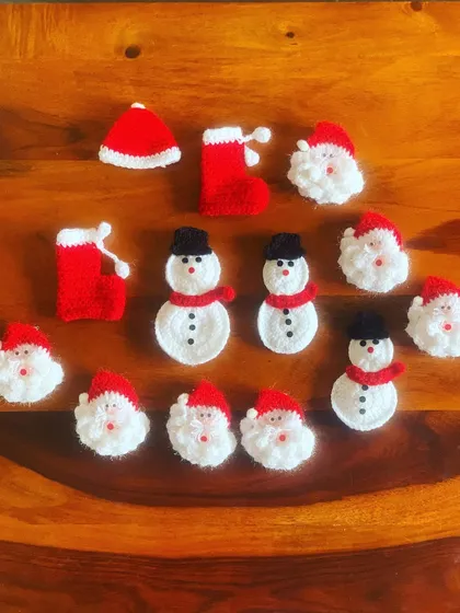 A collection of my cool Christmas brooches, including Santas, snowmen, and stockings. Pin them on your sweater to highlight your outfit.