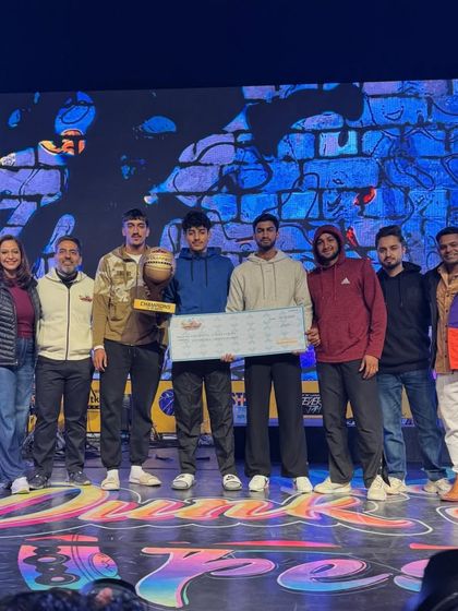 The team on stage with their championship check at the Dunk Street festival. A great moment for the whole #ballinfam.