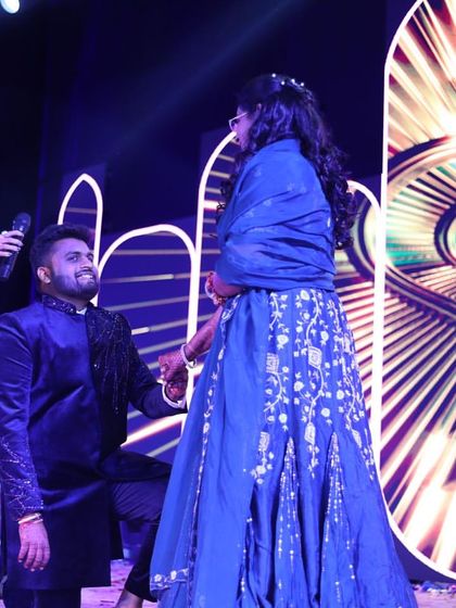 Facilitating a beautiful, romantic moment for a couple on their special day. I help create the perfect atmosphere for proposals and heartfelt exchanges on stage.