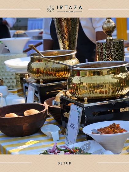 A sunny outdoor setup featuring our golden serving bowls on a cheerful yellow-and-white striped tablecloth, perfect for a daytime celebration.