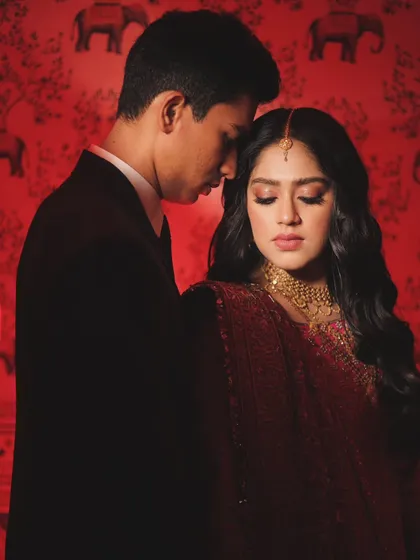 Using a dramatic red background, this portrait feels intense and passionate. I love experimenting with light and color to create couple portraits that have a strong, cinematic feel.