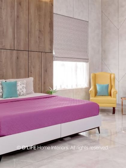 This bedroom features a bright yellow armchair that provides a pop of color against the neutral wall and wardrobe. The design is simple, modern, and cheerful.