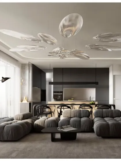 The living area of a Sky Gardens apartment, featuring modern, comfortable furnishings and a custom cloud-like lighting installation, all designed to create a serene and sophisticated home.