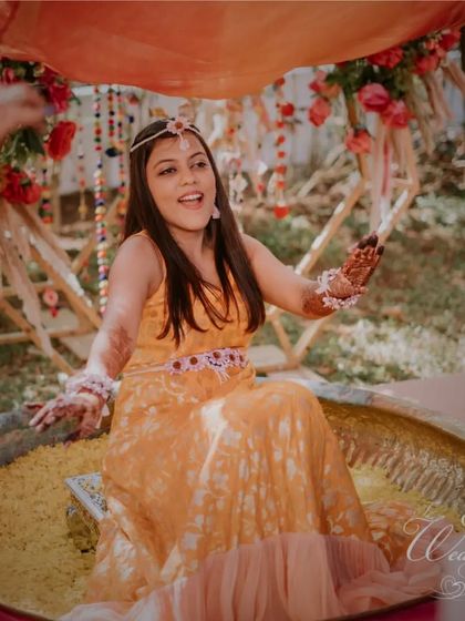A fun and unique part of the Haldi where the bride sits in a large vessel filled with flowers. I love incorporating creative ideas to make traditional ceremonies more memorable.