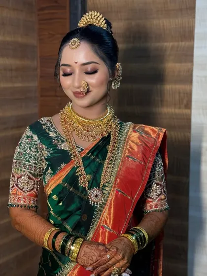 A serene, eyes-closed pose highlighting the flawless and soft eyeshadow work.