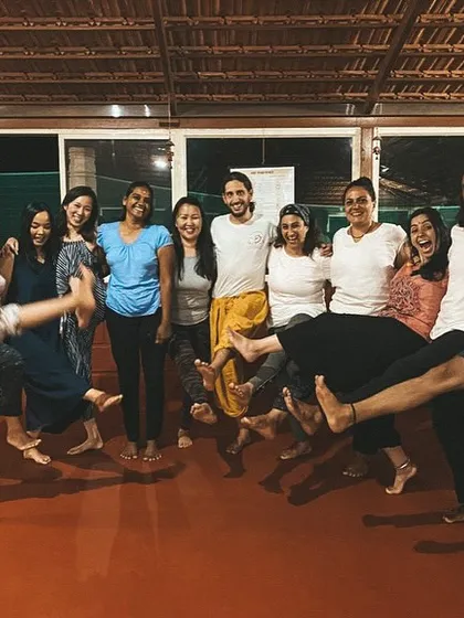 The bonds formed here are strong and full of laughter. A group of students celebrates the end of a class with a playful kick, showcasing the fun and supportive atmosphere.