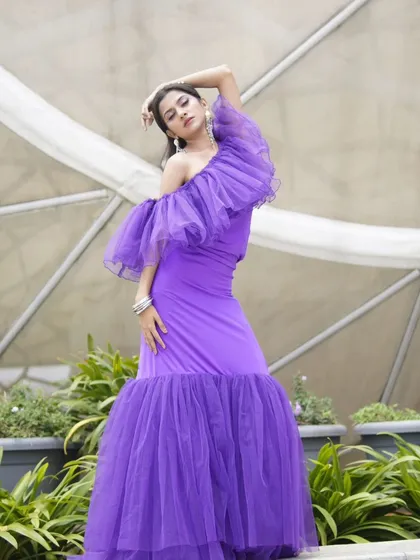 For this designer shoot, the dramatic purple gown called for equally confident makeup. I created a sharp, defined eye look with a neutral lip to balance the vibrant color of the outfit.