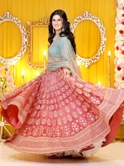 A joyful twirl from the bride-to-be. This action shot perfectly captures her happiness and the beautiful flow of her lehenga.