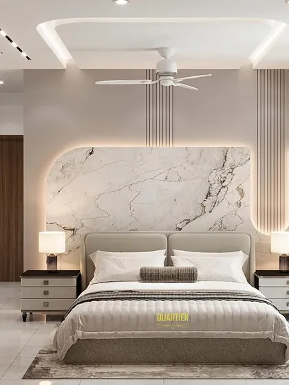 The bed wall of the same master bedroom render. The wall features a large, backlit panel of UV marble with a reverse arch shape, flanked by vertical grooves. The design is dramatic and luxurious.