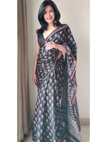 A full view of the printed cotton saree. The soft fabric and classic print make it an essential piece for any summer wardrobe, easy to style for a timeless, elegant look.