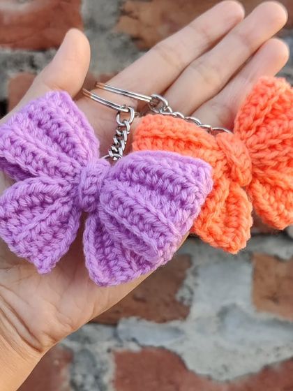 Coquette bow keychains available in a whole spectrum of colors, from bold reds and pinks to earthy tones.