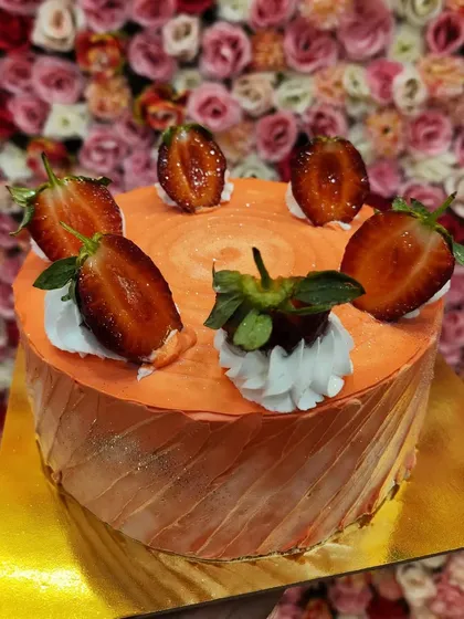 You can't beat the taste of a fresh strawberry fruit cake. I use fresh, juicy strawberries and light cream to create this seasonal favorite. It's a simple, classic cake that's always a crowd-pleaser.