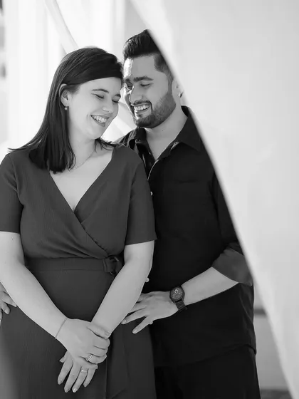 A candid black and white photo capturing genuine laughter and joy, proving that the most beautiful moments are often unposed.