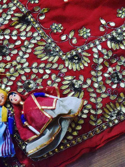 My work is deeply inspired by the rich traditions of Marwari craftsmanship. This is a close-up of gota patti work on a vibrant red fabric, a classic Rajasthani technique that brings a royal touch to any lehenga, saree, or suit.