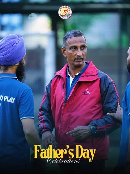 Head coach Jerome Sir in discussion with other coaches during our Father's Day event, showcasing our collaborative coaching approach.