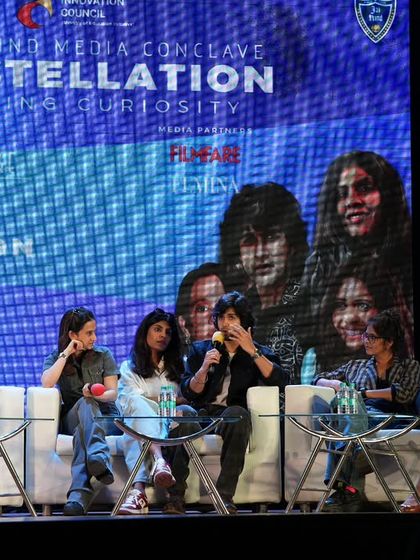 A wider angle of the panel discussion at Jai Hind College, showing the full lineup of filmmakers and actors.