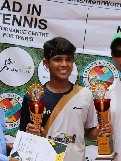 Two champions with their trophies. A great end to a competitive tournament.