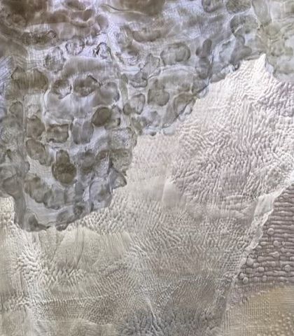 For the 'Sleep Sense' theme, we created a metaphorical space that alludes to pure, stress-free sleep. This installation uses layers of soft, hand-stitched mul fabrics and hand-felted wools to project a warm, cozy, womb-like environment.