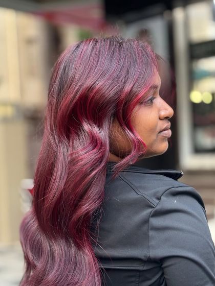 A side profile of the plum red hair, catching the light beautifully and showing off the subtle highlights.