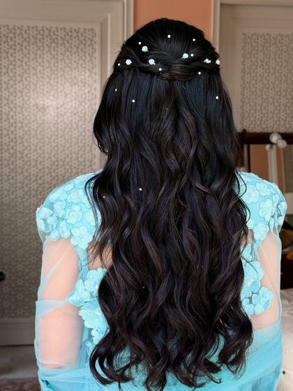Another angle of the dreamy, pearl-adorned hairstyle.