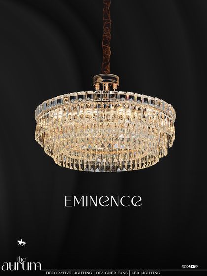 The 'Eminence' chandelier offers a classic drum shape with a modern twist. Its rows of cascading crystals provide a soft, diffused glamour, making it a versatile choice for bedrooms or formal sitting areas.