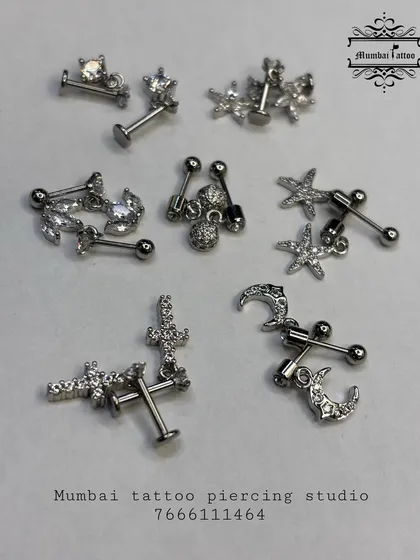 A glimpse into our collection of aesthetic ear studs. This assortment includes various designs like stars, crescent moons, and crosses, all featuring crystal accents and crafted for comfort and style.
