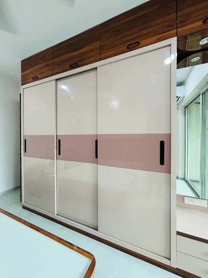 A full view of the three-door sliding wardrobe, showing the smooth, seamless look it provides.