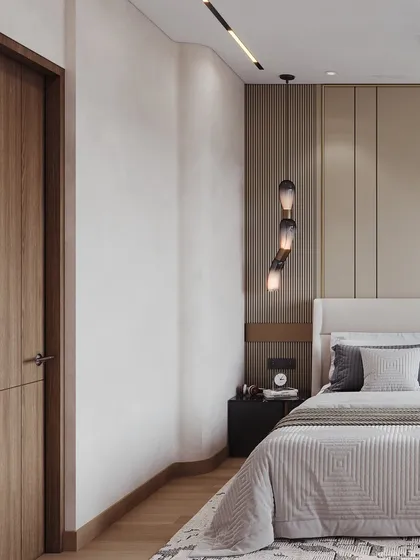 This angle shows the bedside detail, with a cascading pendant light and textured wall panels adding subtle interest to the minimalist design.