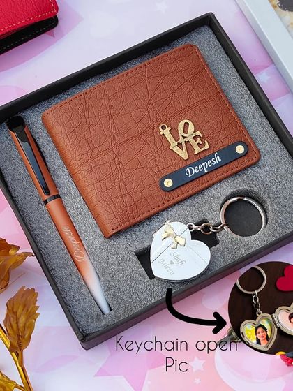 The heart metal key wallet combo shown with a tan wallet and a "LOVE" charm.