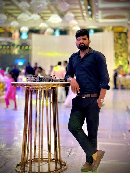 A photo of me with my gear at an event. As a professional drone pilot, I am dedicated to capturing your event from a perspective that makes people say "wow".