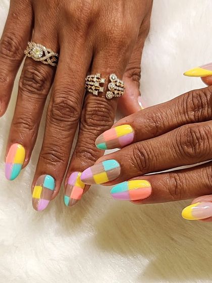 A different view of the pastel color block nails, paired with a yellow French tip for a cohesive, creative look.