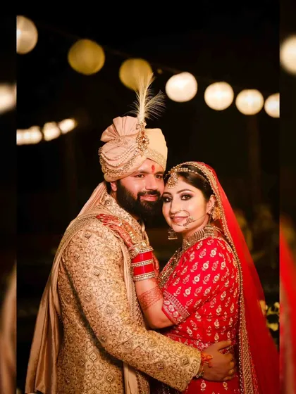 A joyful portrait of the bride and groom. Their happy expressions and beautiful traditional outfits make this a perfect wedding day photograph.