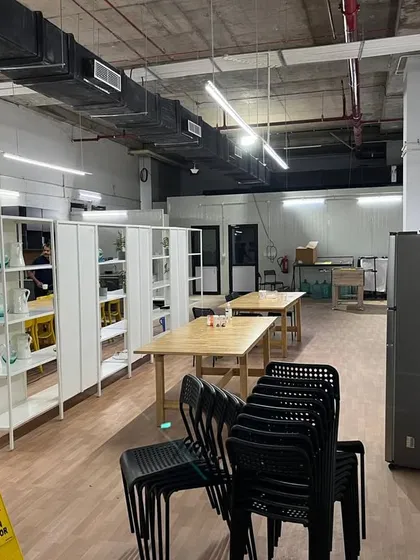 A view of the pantry and break area within the project. We managed the fit-out of this space to provide employees with a functional and comfortable area for breaks, complete with shelving, tables, and seating.