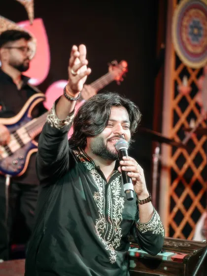 An interactive moment with the audience during a seated performance. Even in a calm setting, we ensure the crowd feels engaged and part of the musical journey.