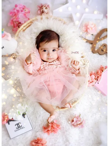 "I chill like my dad but I boss like my mom." This little boss baby is looking fabulous and in charge in her pretty pink outfit.