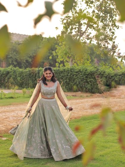 Another shot of my sister-of-the-groom look. The soft, natural lighting highlights the delicate embroidery and the pretty sage green color of the lehenga.