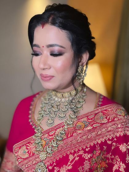 A detailed shot of the smokey eye. We use a blend of deep and soft shades to create dimension, making the eyes the focal point of this glamorous reception look.