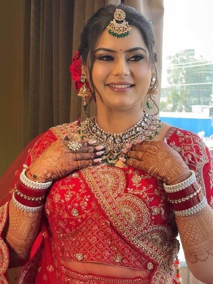 Jagriti's smile says it all. This shot highlights the glowing skin and beautifully blended eye makeup that defined her wedding day look, making her feel confident and special.