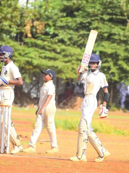 Aayush Ambekar walking out to bat in a competitive match. His confidence is a result of years of hard work and performing on big stages.