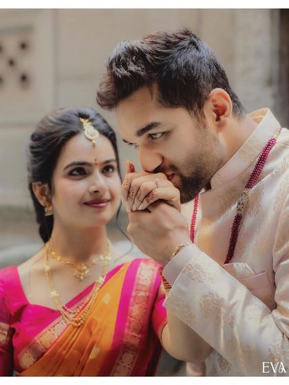 A classic, chivalrous moment as Madhusudhan kisses Siri's hand after their engagement, a gesture full of romance and promise.