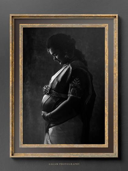 This framed black and white portrait of a mother in a saree is presented as a piece of fine art, perfect for displaying in the home.