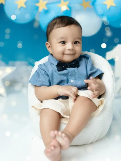 A sweet, gentle smile from the birthday boy during his half-year milestone session.
