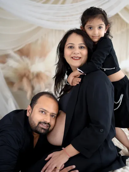 Your growing family is a story we love to tell. This portrait captures the sweet anticipation of a new arrival with the whole family, including the soon-to-be big sister. We style these sessions to be natural and full of genuine connection.