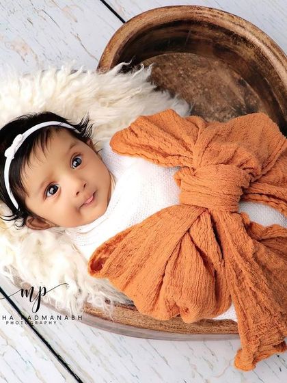 This angle shows the baby looking up, with the shape of the heart bowl creating a lovely frame.