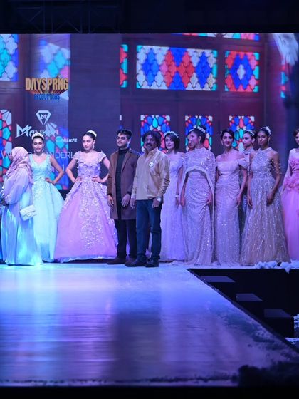 The full cast of models showcasing the diverse range of the GULFAM collection, from pastel ball gowns to rich, traditional lehengas.
