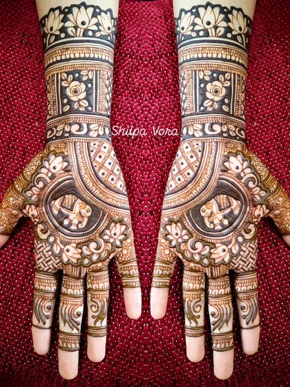 A beautiful symmetrical design with elephants and floral patterns, perfect for a bride or festive occasion.
