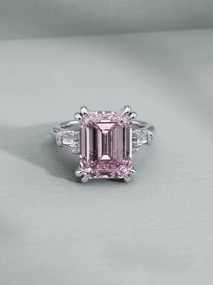 A soft and romantic take on the statement ring, featuring a beautiful pink emerald-cut gemstone. This shows how changing the stone can completely transform the mood of a piece.