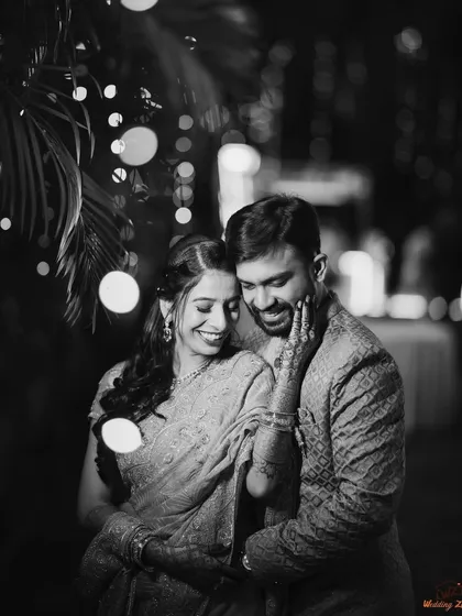 A timeless black and white portrait of Varad and Dr. Rutuja. The string lights create a beautiful, romantic backdrop for this intimate moment.