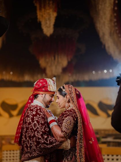 An intimate moment between the couple. Riiya's makeup looks flawless up close, with a focus on glowing skin and defined eyes.