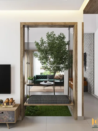 An indoor swing framed by a wooden archway, providing a playful and relaxing element that connects different zones of the house.